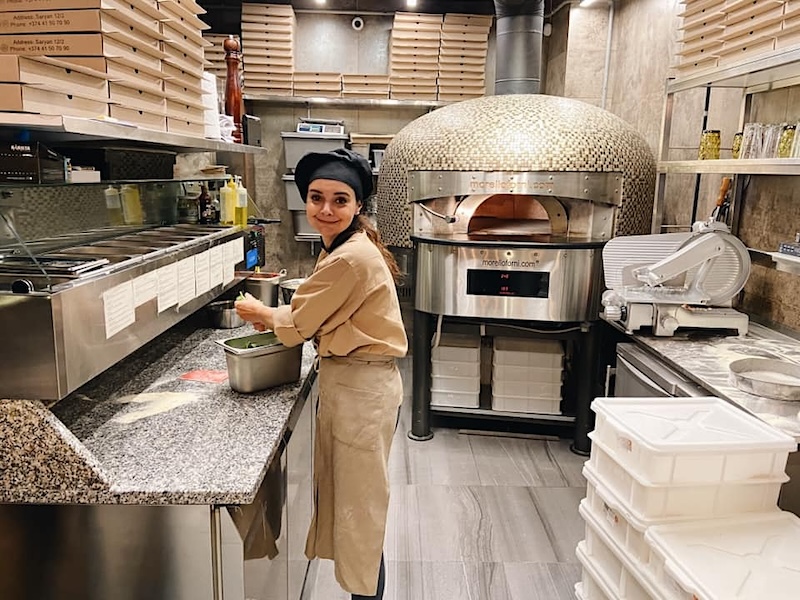 Heghine Baking Pizza